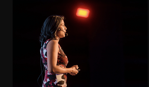  Dr. Lipi Roy delivering a keynote at the Power of Storytelling conference in Bucharest, Romania. Photo by Vlad Cupsa of KOMITI.