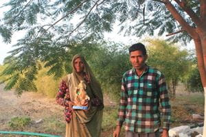 An Indian couple on their farm