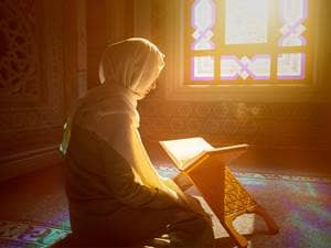 Muslim woman in prayer