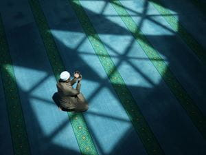 Muslim man in prayer