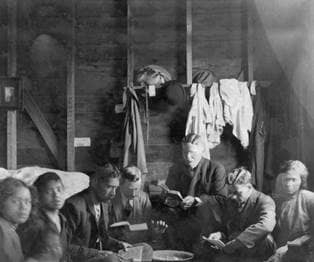 Orson D. Romney reading with missionaries in New Zealand, 1912.