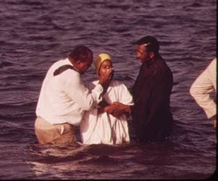Baptism ceremony performed by members of the "Church of God in Christ".