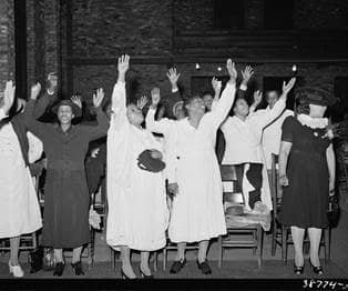 Members of the Pentecostal church praising the Lord. Chicago, Illinois.