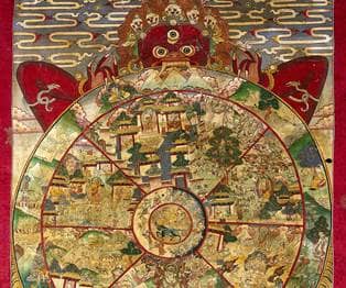 Yama, the Lord of Death, holding the Wheel of Life which represents Samsara.