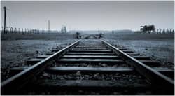 Tracks at Auschwitz-Birkenau: photo courtesy of Greenwich Photography via C.C. license at Flickr