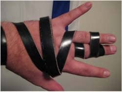 The Ashkenazi way to wrap the tefillin straps on your hand, forming the Hebrew letter Shin (ש) over the hand. Photo by Yonkeltron via Wikimedia CC