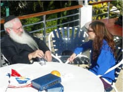 Rabbi Manis Friedman with a student at Bais Chana via Talia Davis