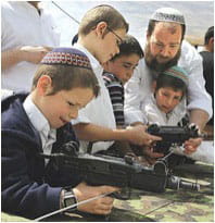Settlers teaching their children to shoot: Photo courtesy of Bird Eye via C.C. license at Flickr