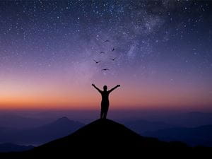 woman with arms raised