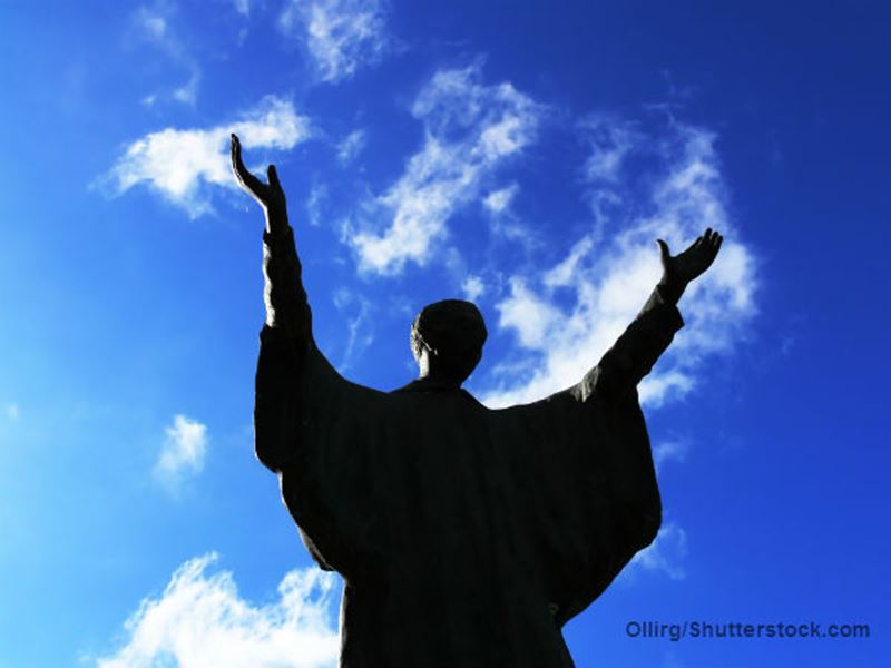 Silloutte of man praising